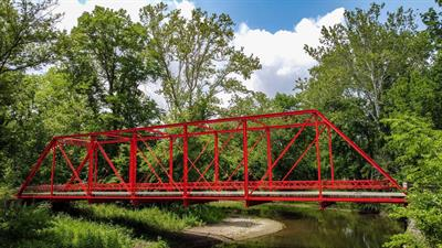 Iconic red truss bridge near Holliday Farms in Zionsville, Indiana